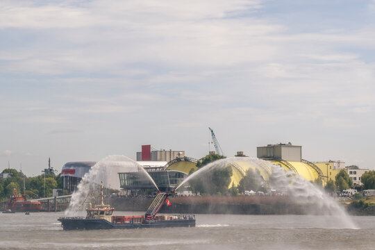 Fireboat spraying water at Port anniversary in Hamburg Landungsbr�cken