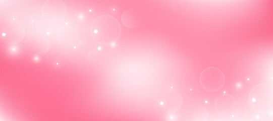 A soft pink gradient background with a bokeh effect and bright glowing dots. Concept for an abstract pastel banner for Valentine's Day, a wedding card backdrop, or a cosmetics ad.