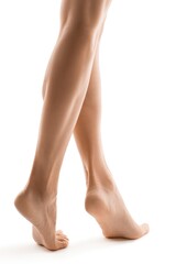 Woman's legs and feet stand delicately on a white surface, showcasing beauty and health