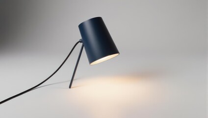 Modern Black Desk Lamp Illuminating White Surface with Warm Light.