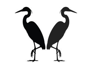 Obraz premium Silhouettes of two elegant herons standing gracefully in a natural setting