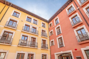 Fototapeta premium Corner View of Classic Residential Spanish Buildings with Wood Eaves, Architecture Heritage