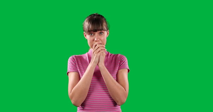 Surprised Caucasian woman on green background