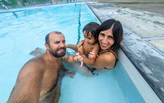 Family enjoying hot spring in jasper national park, canada