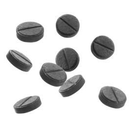 detailed photograph featuring nine activated charcoal tablets on a solid transparent background, ideal for showcasing natural health remedies and detox supplements