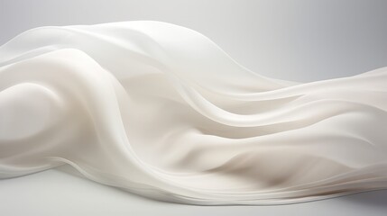 Elegant white fabric draped in smooth flowing curves on gray background