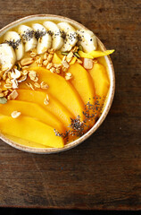 Smoothie bowl with fresh fruit and granola, healthy eating