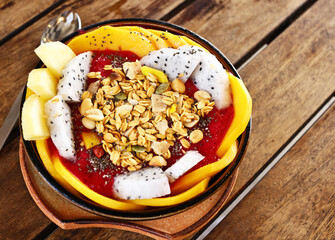 Smoothie bowl with fresh fruit and granola, healthy eating