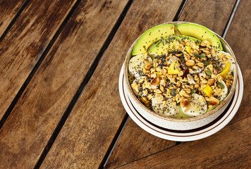 Smoothie bowl with fresh fruit and granola, healthy eating