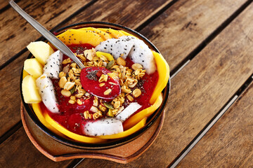 Smoothie bowl with fresh fruit and granola, healthy eating