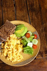 traditional breakfast with fried egg and salad
