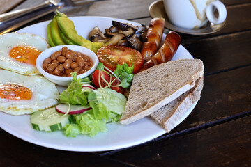 traditional breakfast with fried egg and salad