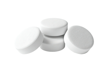 Four round, white pills stacked atop each other