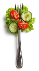 Fork holding fresh green lettuce cucumber tomato salad