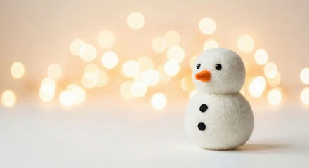 Little Felt Snowman with Blurry Festive Lights Background