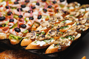 Assorted crostini canapes on catering tray