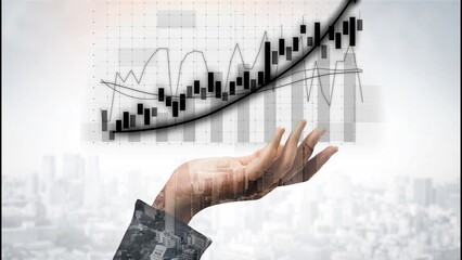 Conceptual image of a hand reaching out towards a digital graph illustrating financial growth and...