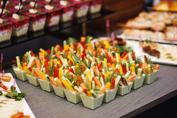 Vegetable sticks with dip in catering cups
