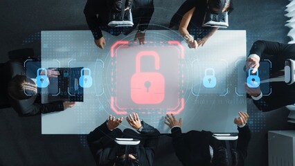 A diverse business team focused on enhancing cybersecurity strategies, surrounded by modern technology and a digital lock symbolizing security during a crucial meeting. Raster