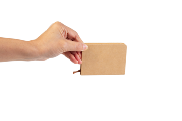 A small brown notebook in hand against a transparent background.