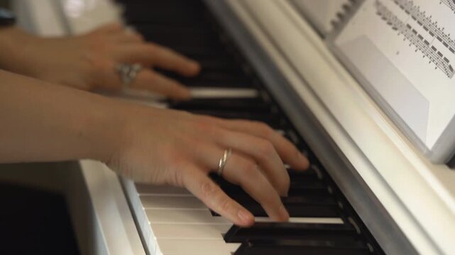 Piano Hands Closeup, Detailed View Of Hands On Piano During Focused Practice With Gentle Lighting . Media