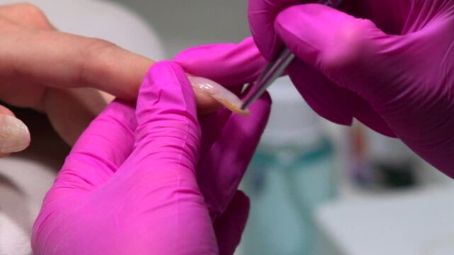 Detailed Technician Nail Inspection, Technician Conducts Precise Nail Inspection Prior To Final Styling . Media