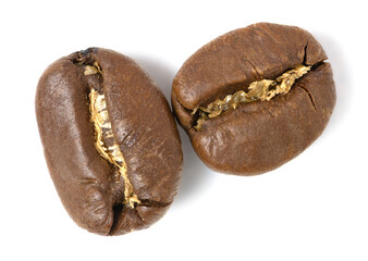 Three roasted coffee beans isolated on white background with detailed surface texture and visible roasting cracks.
