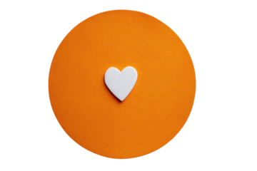 White heart shape on textured orange circle against black background image