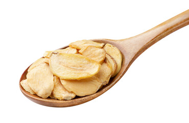 Dried garlic flakes in a wooden spoon on a white. Isolated