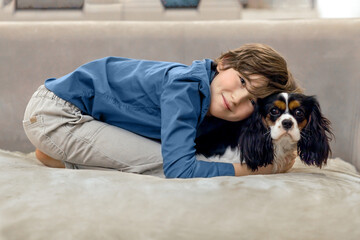 Portrait of a boy with his beloved dog.