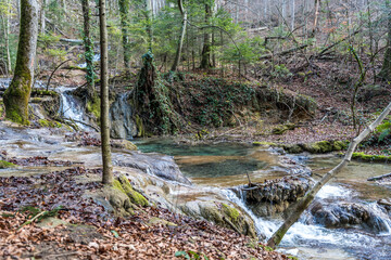 Waterfalls and Cascades of the Nera River (Cheile Nerei Beusnita) National Park, Romania. Hiking the gorge and exploring emerald pools. Romanian beauty and nature.