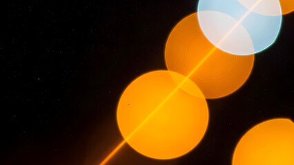 Night Bokeh Lights Photograph, Abstract Warm and Cool Bokeh, Diagonal Glowing Light Circles, Soft Focus Night Sky Lights, Atmospheric Black Background Bokeh Image