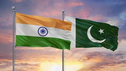 India and Pakistan flags waving together during golden sunset