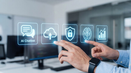 Close-up of a man interacting with holographic interface icons including AI chatbot, cloud upload, cybersecurity, brain, and analytics in modern office.