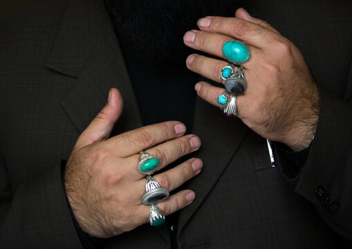 Iranian man with rings on fingers during chehel menbari festival, Lorestan, Khorramabad, Iran