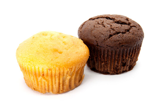Chocolate and vanilla muffins on the white background