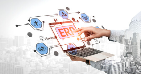 A professional interacts with a laptop displaying a digital interface for enterprise resource planning, representing modern business strategies and cloud solutions. Tessel