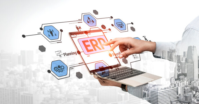 A professional interacts with a laptop displaying a digital interface for enterprise resource planning, representing modern business strategies and cloud solutions. Tessel - Powered by Adobe