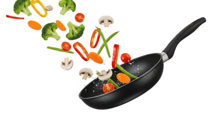 Vegetables and mushrooms being tossed in a black frying pan with ingredients flying through the air captured in a dynamic png image