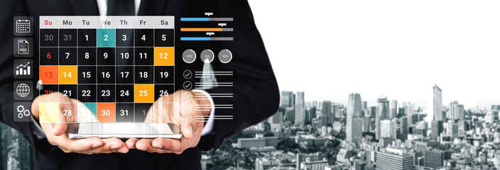 A businessman in a suit holds a digital tablet displaying a modern calendar interface. The city skyline in the background emphasizes themes of organization and productivity. Gantry