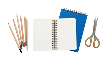 Various school supplies including notebooks, colored pencils, and scissors arranged on a white background for a study session or art project