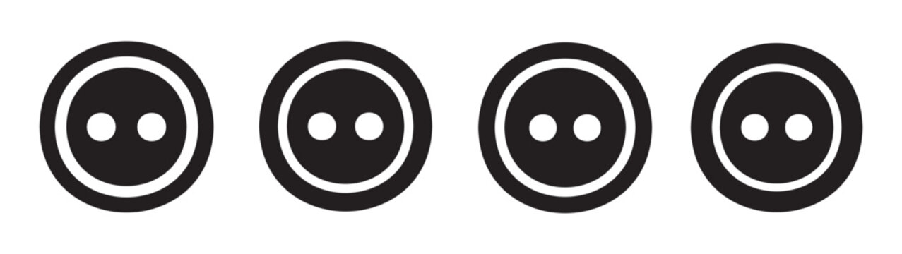 Four black sewing buttons with two holes each are neatly aligned in a row, representing a classic design element for fashion and crafts.