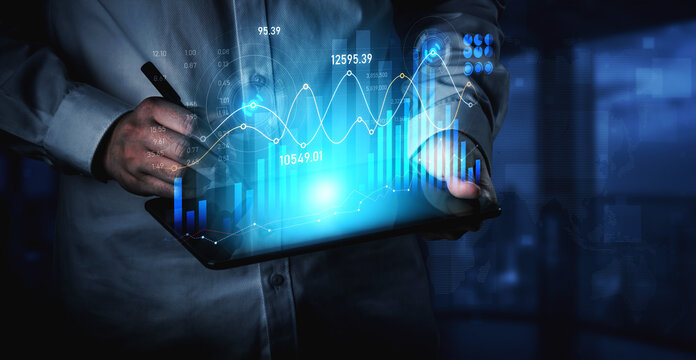 A business professional analyzes data on a digital tablet, showcasing financial charts and graphs in a sleek, modern workspace. Ideal for finance and technology concepts. Scalp - Powered by Adobe