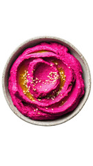 Bright pink hummus in a bowl with olive oil and sesame seeds