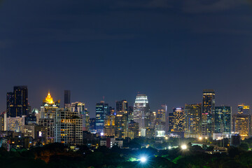 Aerial view Bangkok cityscape background on night scene from viewpoint of high modern building, It show the prosperity and is also a tourist destination for relaxation or business Bangkok, Thailand