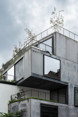 Modern Concrete Residential Building with Green Terraces