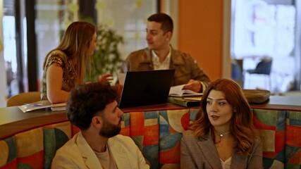 People are actively participating in a business meeting, sharing insights and working together. Their collaborative discussion creates a productive atmosphere, fostering innovation and teamwork.