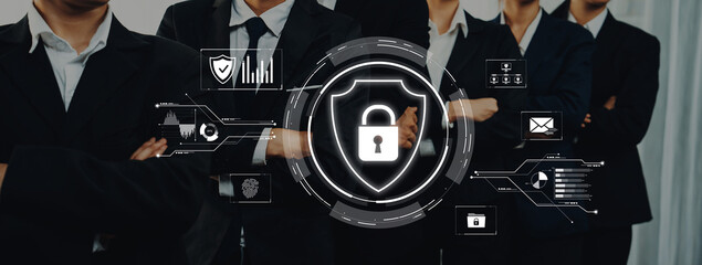 A professional group of business individuals stands confidently, showcasing cybersecurity symbols...