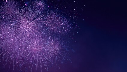 A vibrant display of violet fireworks explodes against a deep, dark blue sky, with scattered sparks adding to the festive atmosphere