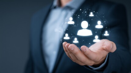 Hand holding illuminated user icons representing networking, community, and social media connections